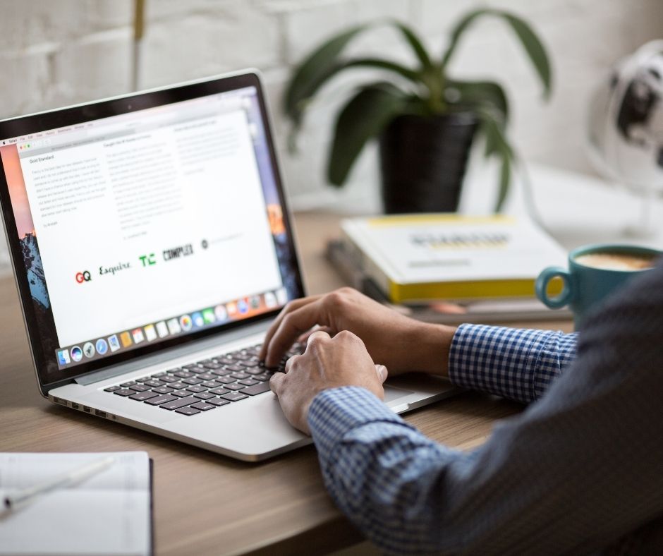Photo of a person working on a laptop computer