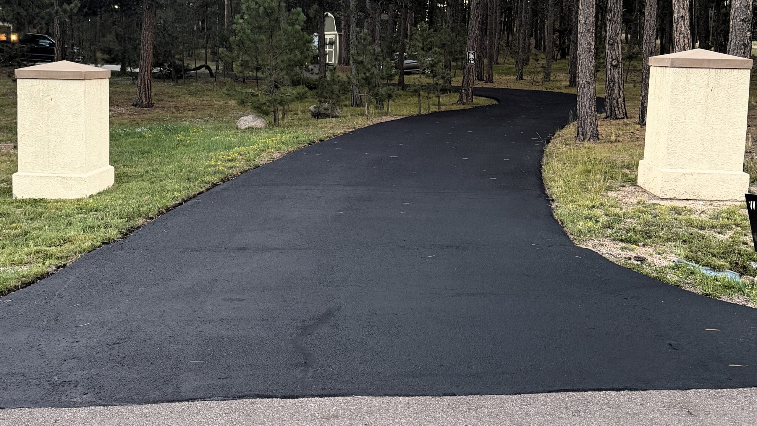 Freshly sealed driveway in Monument, Colorado - White Stripes Parking Maintenance